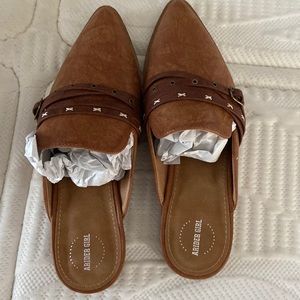A Rider Girl slip on shoes.  Brand new still in box.  Whiskey color.